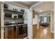 Convenient laundry room with modern appliances, shelving, and easy access to the living area at 270 Shady Marsh Trl, Roswell, GA 30075
