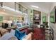 Bright, open living room with skylights, stone fireplace, and a kitchen area nearby at 270 Shady Marsh Trl, Roswell, GA 30075
