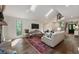Open living area with hardwood floors, modern fireplace, and views of the front entry at 270 Shady Marsh Trl, Roswell, GA 30075