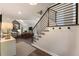 Open-concept living area with stone fireplace, vaulted ceilings, and modern railing staircase at 270 Shady Marsh Trl, Roswell, GA 30075