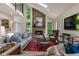 Comfortable living room with stone fireplace, high ceilings and a contemporary aesthetic at 270 Shady Marsh Trl, Roswell, GA 30075