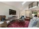Bright and airy living room featuring a modern staircase, skylights, and hardwood floors at 270 Shady Marsh Trl, Roswell, GA 30075
