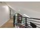 Cozy loft featuring a stone fireplace, modern railing, and abundant natural light at 270 Shady Marsh Trl, Roswell, GA 30075