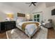 Serene primary bedroom featuring a large bed, stylish decor, and a cozy seating area, creating a relaxing retreat at 270 Shady Marsh Trl, Roswell, GA 30075