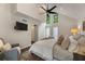 Spacious primary bedroom boasting vaulted ceilings, large windows, and a barn door for access to ensuite bathroom at 270 Shady Marsh Trl, Roswell, GA 30075