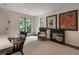 Well-lit office area with comfortable armchair, side table, and natural light, creating an ideal work-from-home space at 270 Shady Marsh Trl, Roswell, GA 30075