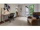Bright home office with natural light, a desk, comfortable seating, and serene views of the outdoors, ideal for working at 270 Shady Marsh Trl, Roswell, GA 30075
