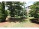 Spacious backyard with lush greenery, mature trees, and landscaping at 3220 Creole Ln, Avondale Estates, GA 30002