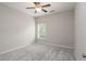 Bedroom with neutral walls, carpet, ceiling fan and natural light from the window at 3220 Creole Ln, Avondale Estates, GA 30002