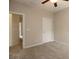 Bedroom features neutral walls, carpet, ceiling fan and two doors at 3220 Creole Ln, Avondale Estates, GA 30002