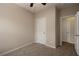 Neutral bedroom featuring carpet, two doors and a ceiling fan at 3220 Creole Ln, Avondale Estates, GA 30002