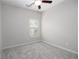 Neutral bedroom featuring carpet, ceiling fan, and a window at 3220 Creole Ln, Avondale Estates, GA 30002