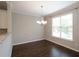 Sunlit dining area features a modern chandelier and a large window at 3220 Creole Ln, Avondale Estates, GA 30002
