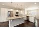 Bright kitchen boasts granite counters, stainless steel appliances, and stylish pendant lighting above a kitchen island at 3220 Creole Ln, Avondale Estates, GA 30002