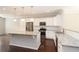Modern kitchen featuring white cabinetry, granite countertops, and stainless steel appliances at 3220 Creole Ln, Avondale Estates, GA 30002