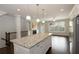 Open kitchen layout with a large island, stainless steel appliances, and hardwood floors at 3220 Creole Ln, Avondale Estates, GA 30002