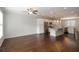 Open-concept layout showcases a modern kitchen with stainless steel appliances and a granite island at 3220 Creole Ln, Avondale Estates, GA 30002