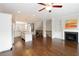 Open concept living space seamlessly connects the kitchen, dining area, and living room with a fireplace at 3220 Creole Ln, Avondale Estates, GA 30002