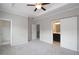 Spacious main bedroom boasts a tray ceiling and a sliding barn door leading to the ensuite bathroom at 3220 Creole Ln, Avondale Estates, GA 30002