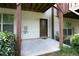 Back patio area with concrete flooring, a door and a partially shaded lawn at 3220 Creole Ln, Avondale Estates, GA 30002
