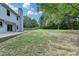 Large backyard with patio perfect for entertaining or relaxing near wooded area at 3668 Burel Mill Dr, Buford, GA 30519