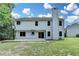 Spacious backyard with partial view of the house and a basketball hoop at 3668 Burel Mill Dr, Buford, GA 30519