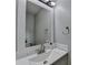Well-lit bathroom with a modern sink, stylish faucet and a neutral color palette at 3668 Burel Mill Dr, Buford, GA 30519