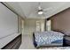 Bright bedroom with a large projector screen, ceiling fan, and comfortable bedding at 3668 Burel Mill Dr, Buford, GA 30519