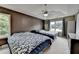 Spacious bedroom with two beds, large windows, a ceiling fan, and ample closet space at 3668 Burel Mill Dr, Buford, GA 30519