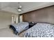 Spacious bedroom featuring two beds, ceiling fan, and ensuite bath at 3668 Burel Mill Dr, Buford, GA 30519