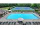 Community pool and tennis courts with ample lounge chairs and well-maintained landscaping at 3668 Burel Mill Dr, Buford, GA 30519