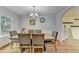 Dining room with neutral wall paint, decor, and a view into other rooms at 3668 Burel Mill Dr, Buford, GA 30519