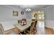Charming dining room with a view to the kitchen, archway, and hardwood floors at 3668 Burel Mill Dr, Buford, GA 30519