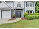 Close-up of a charming two-story home featuring a well-manicured lawn and inviting entrance at 3668 Burel Mill Dr, Buford, GA 30519