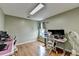Home office area featuring a window and hardwood floors; great for working at home at 3668 Burel Mill Dr, Buford, GA 30519
