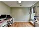 Home office area featuring a window and hardwood floors; great for working at home at 3668 Burel Mill Dr, Buford, GA 30519
