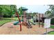 Community playground featuring slides, climbing structures, and a safety-surfaced play area at 3668 Burel Mill Dr, Buford, GA 30519