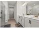 Modern bathroom with dual sinks, quartz countertops, walk-in glass shower, and updated fixtures at 5121 Aster Bnd, Canton, GA 30114