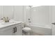 Clean bathroom with a combined tub and shower, subway tile, modern fixtures, and bright lighting at 5121 Aster Bnd, Canton, GA 30114
