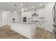 Modern kitchen features stainless steel appliances, granite countertops, and a center island at 5121 Aster Bnd, Canton, GA 30114