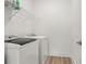 A tidy laundry room area equipped with modern washer and dryer units at 5121 Aster Bnd, Canton, GA 30114