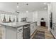 Open-concept kitchen and living area with hardwood floors and lots of natural light at 5121 Aster Bnd, Canton, GA 30114