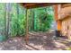 View of natural wooded backyard with patio area at 7074 Springgrove Ct, Austell, GA 30168
