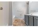 Bathroom with large tub, single sink vanity, and neutral colors at 7074 Springgrove Ct, Austell, GA 30168