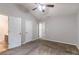 Bedroom with carpet flooring, neutral walls, and multiple doorways at 7074 Springgrove Ct, Austell, GA 30168