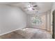 Bedroom with vaulted ceiling, ceiling fan, and natural light from window at 7074 Springgrove Ct, Austell, GA 30168