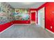 Bright bedroom featuring custom comic book wallpaper and carpet at 7074 Springgrove Ct, Austell, GA 30168