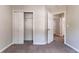 Bedroom features neutral walls, carpet, and closet at 7074 Springgrove Ct, Austell, GA 30168