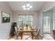 Staged dining room featuring a large window with view and chandelier lighting at 7074 Springgrove Ct, Austell, GA 30168