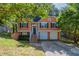 Charming two-story home with attached two-car garage and inviting front porch at 7074 Springgrove Ct, Austell, GA 30168